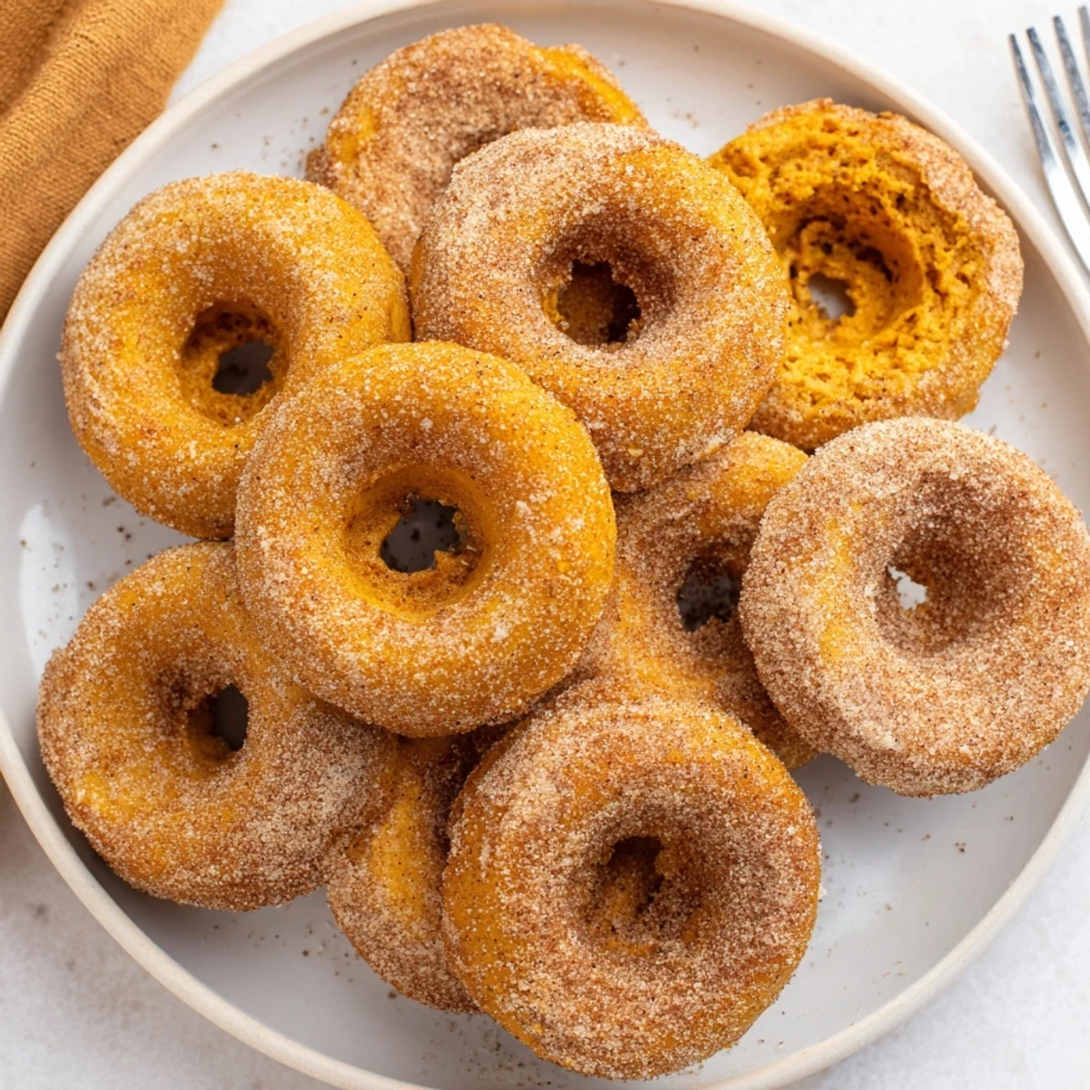 Fluffy vegan pumpkin muffin donuts perfect for autumn breakfast or sweet gatherings.
