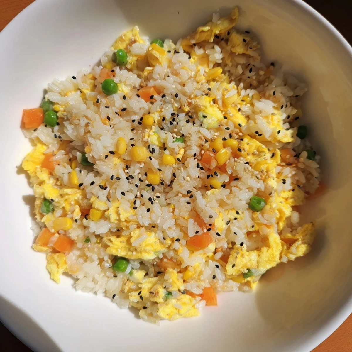 Enjoy the savory aroma of this quick and easy Frozen Veggie Fried Rice, a vegetarian meal everyone loves.