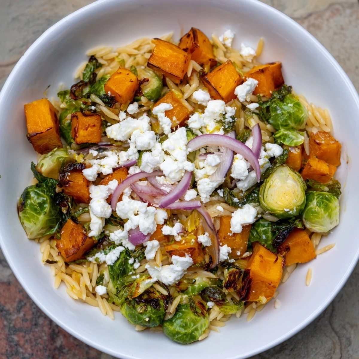 A close-up of the delicious Best Fall Harvest Orzo Salad, showcasing colorful ingredients and inviting textures.