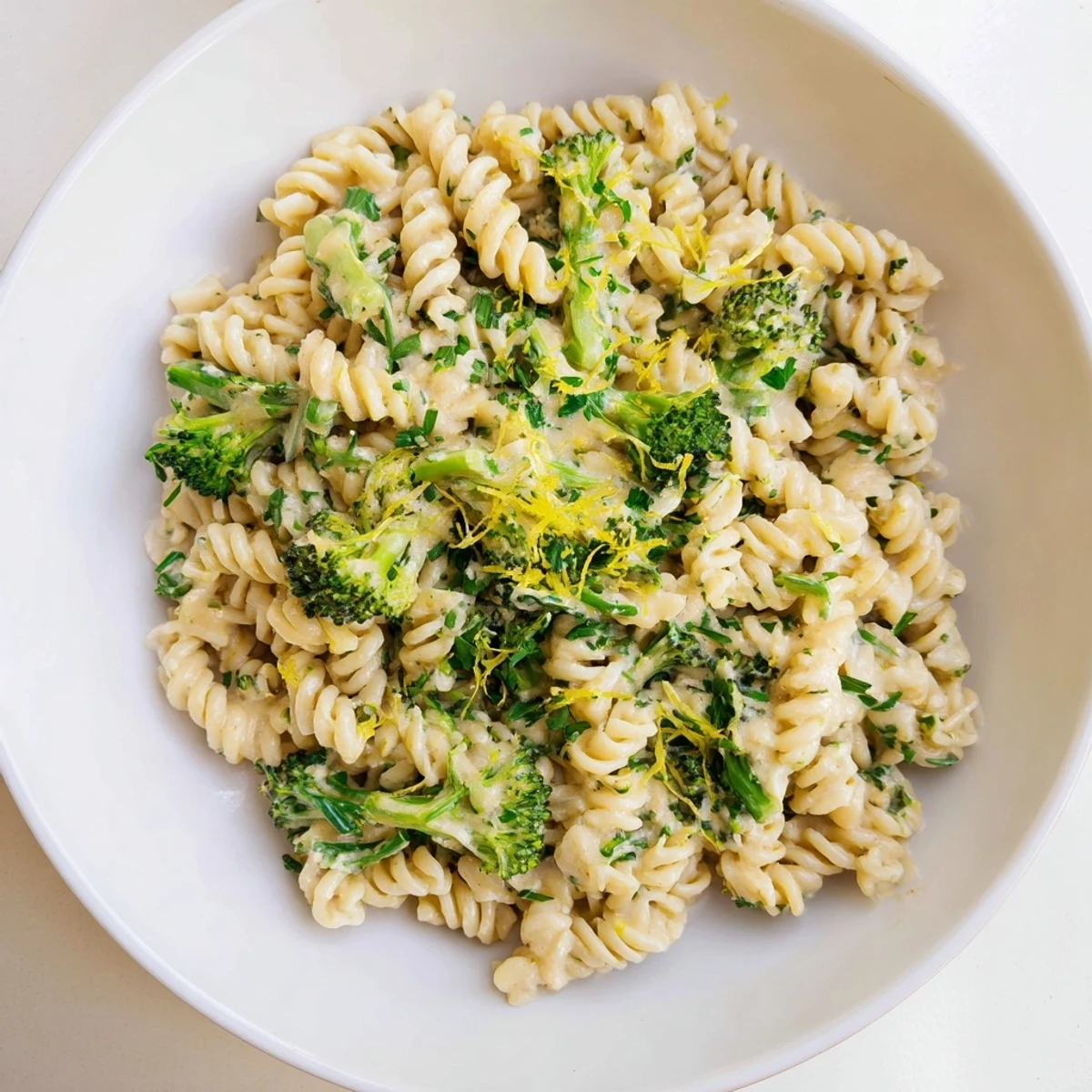 A bubbling pot of green goddess broccoli cheddar one-pot pasta, ready to be served hot and delicious.