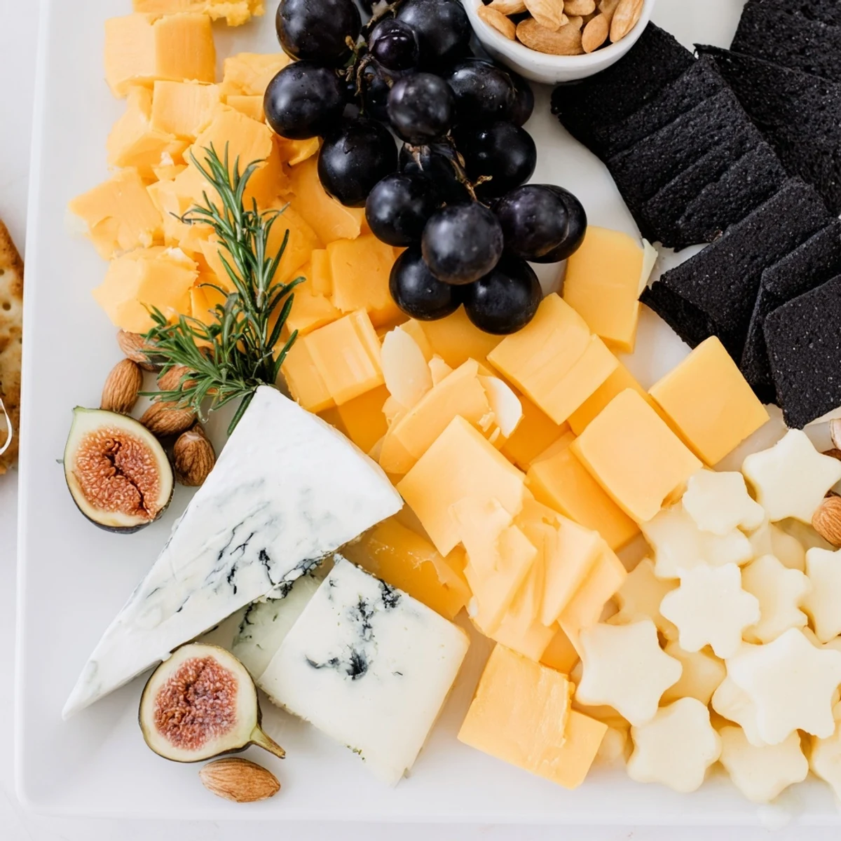 Crescent Moon & Stars Cheese Board: A vibrant photo of cheeses, crackers, and stars arranged for a party.