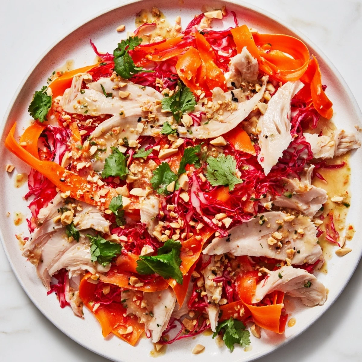 Tender chicken and carrot ribbons mingle in this fresh, colorful Carrot Ribbon and Chicken Slaw.