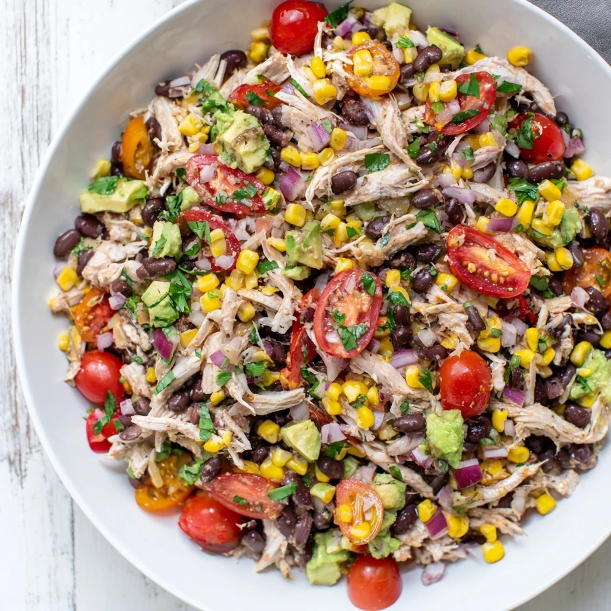 Close-up of fresh Southwestern Bean Salad: a flavorful, protein-packed dish with visible black beans and corn.