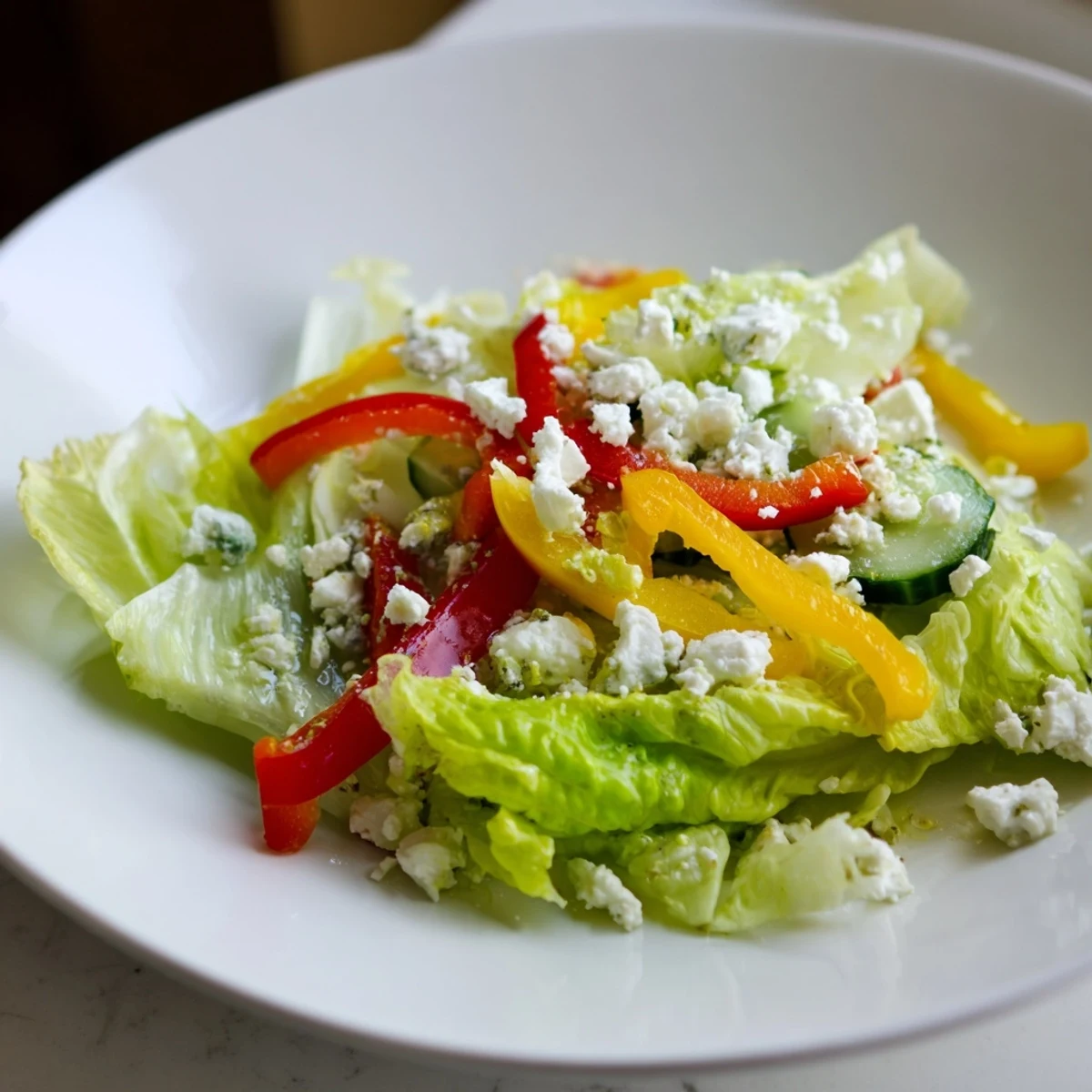 A refreshing Bella Hadid Salad with colorful bell peppers, creamy feta, and zesty lemon dressing.
