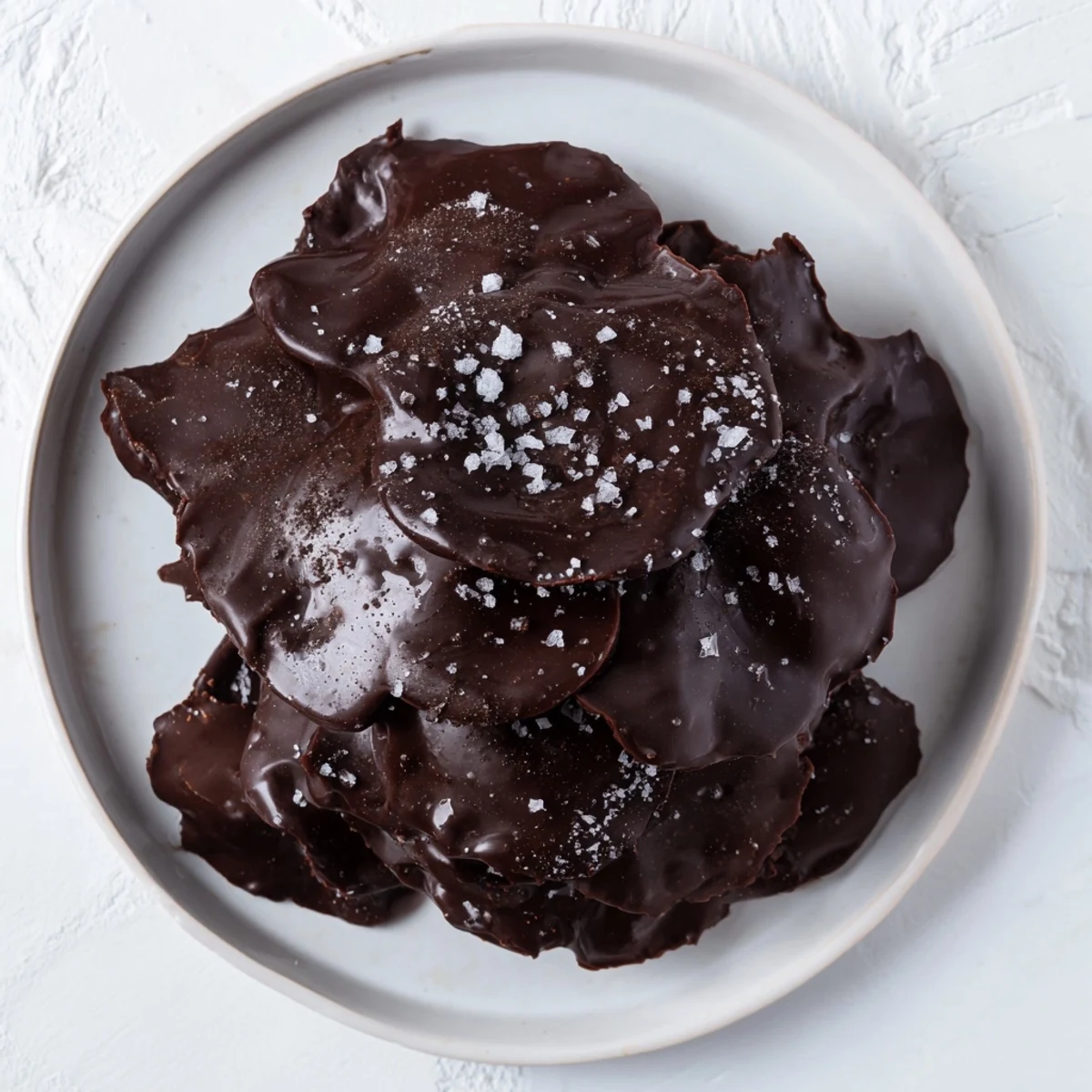 Mouthwatering image of Chocolate Potato Chip Bark, showcasing layers of sweet chocolate and salty chips.