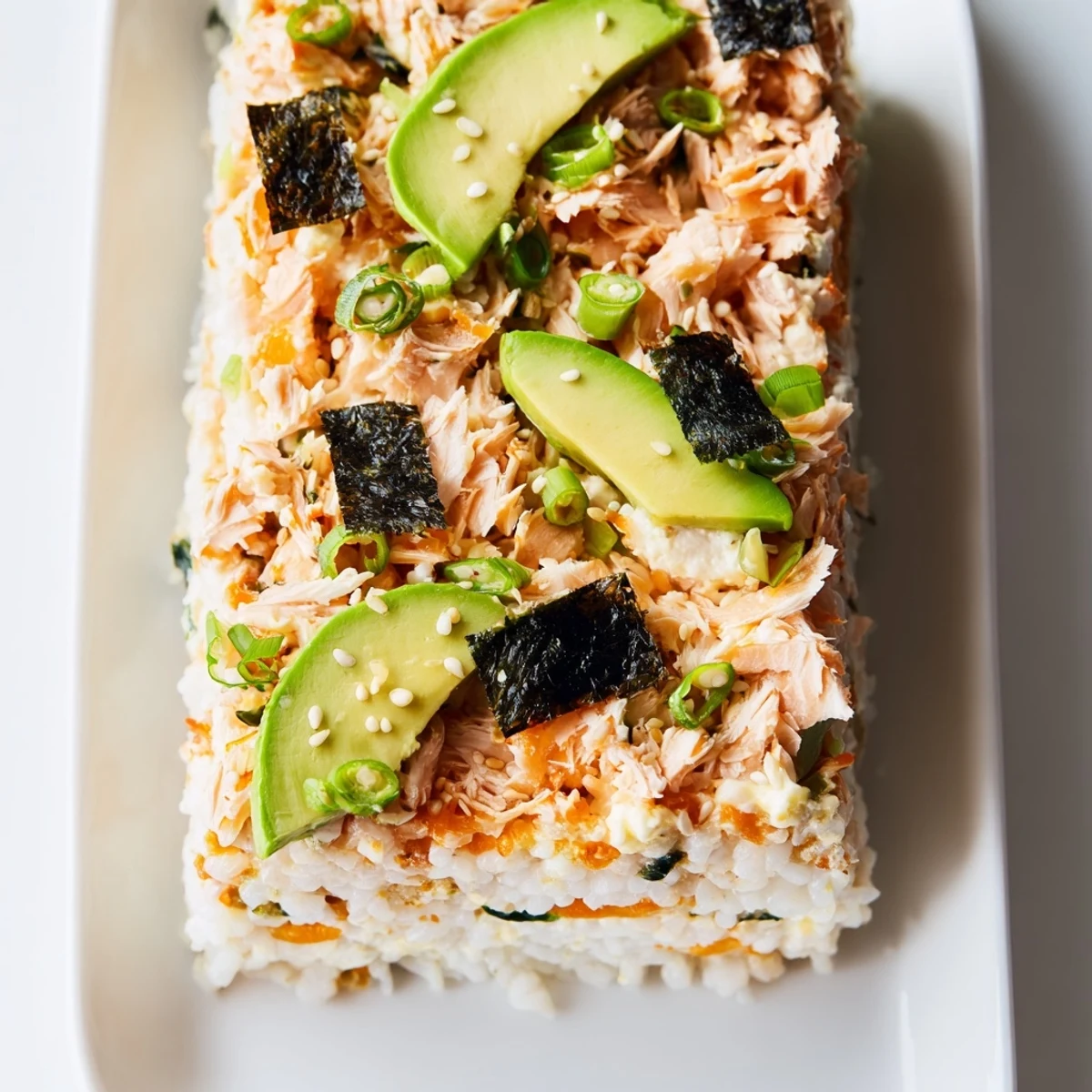 Creamy, layered sushi bake casserole freshly baked; imagine the savory aroma and tastes.