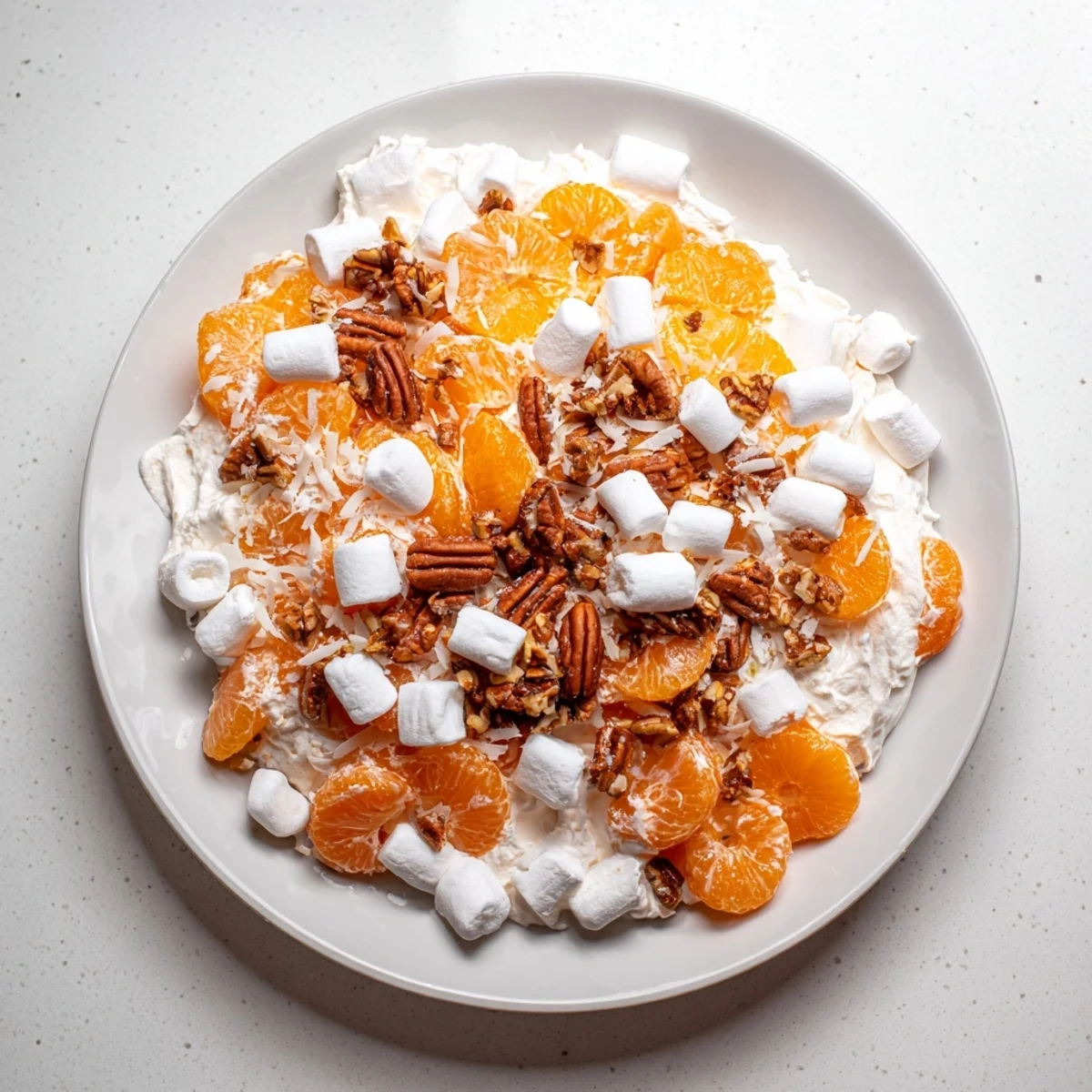 Refreshing, colorful Elevated Ambrosia Salad, perfect dessert featuring mandarin oranges and toasted pecans.