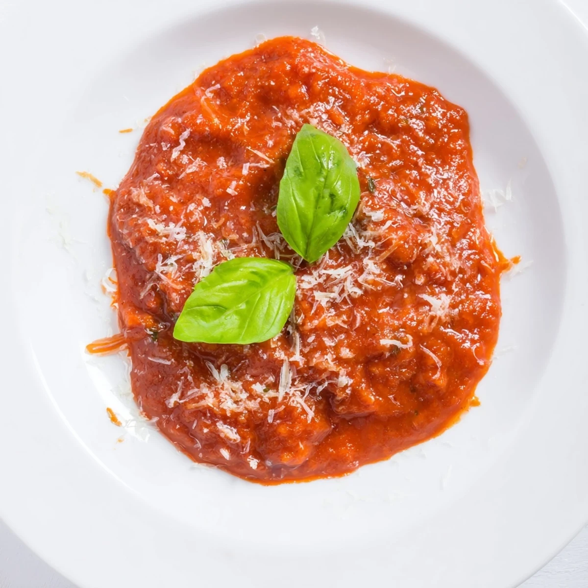 Vibrant Hidden Veggie Tomato Pasta Sauce swirling in a bowl, a delicious, healthy Italian meal.
