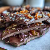 Decadent dark chocolate bark with vibrant candied orange peel, perfect for Valentine's Day gifting or elegant dessert platters.  
