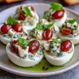 Close-up of Caprese Deviled Eggs, a colorful Italian appetizer perfect for parties.