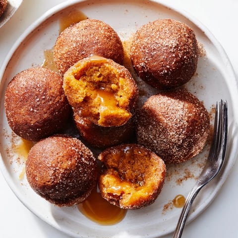 Soft chai caramel pumpkin pancake muffin balls, warm and drizzled with cinnamon sugar glaze.  