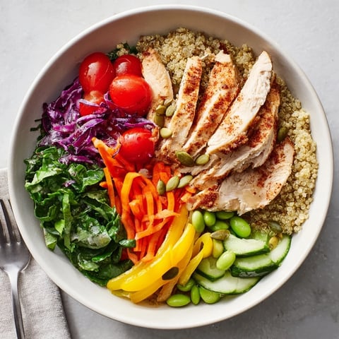 Colorful Healthy Meal-Prep Bowls filled with quinoa, chicken, and fresh veggies.  