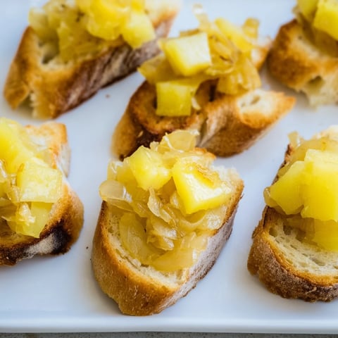 French Onion Pot Roast Casserole bubbling with melted cheese and crispy bread topping, a comforting meal.