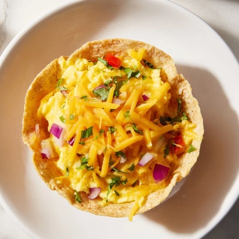 Golden, bubbly Sheet Pan Breakfast Tacos ready to enjoy with a side of fresh avocado slices.