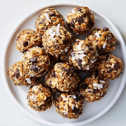 Delicious Almond-Chia Energy Bites ready to eat, showing a close-up of the rolled, bite-sized snacks.
