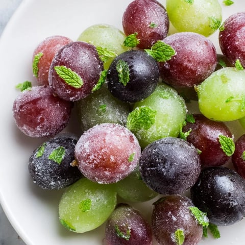 Frozen grapes spa treat, a vibrant image of juicy, frozen grapes perfect for a refreshing snack.