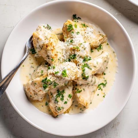 Close-up of Creamy Garlic Chicken simmering; a comforting, delicious main dish recipe.