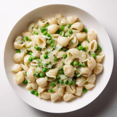 A close-up shot of the warm Macaroni & Peas, ready to be served for a simple dinner.