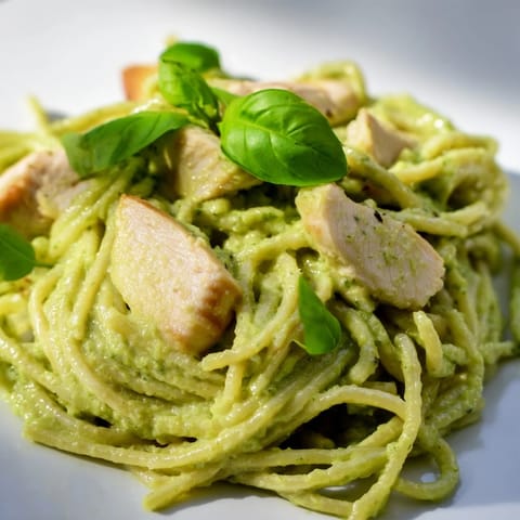 Creamy Avocado Chicken Pasta features fork-tender pasta coated in fresh avocado sauce, bright lemon notes, and juicy grilled chicken slices.