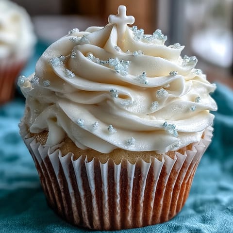 Fluffy vanilla Communion cupcakes with elegant white fondant crosses, perfect for celebrations.