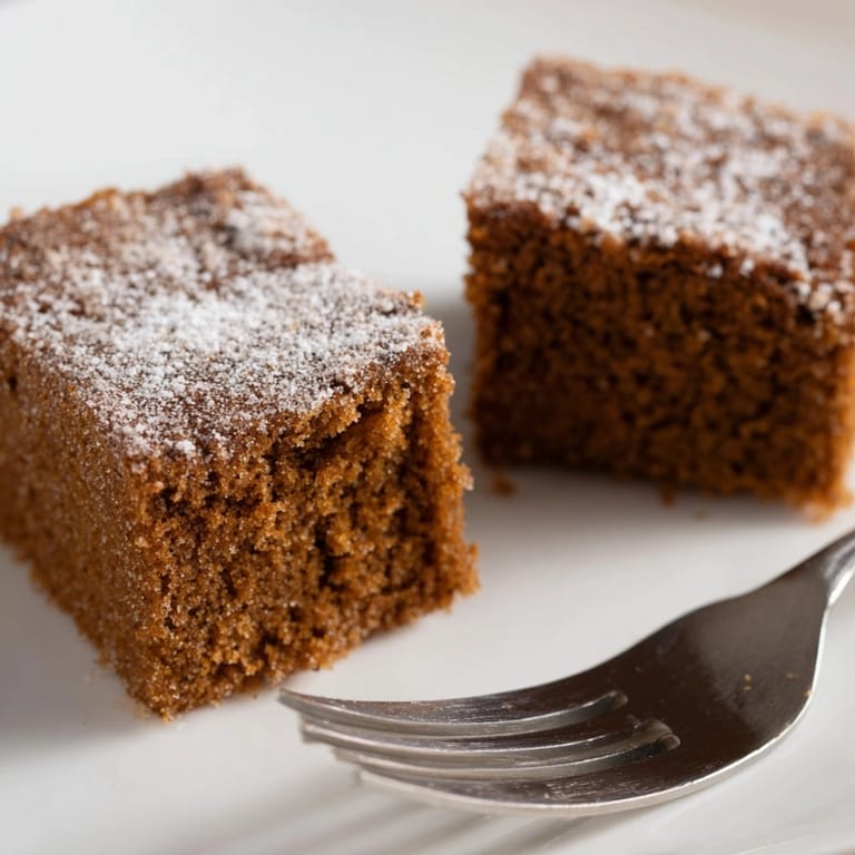 Close-up of Cinnamon Gingerbread Snack Cake: tender crumb, subtly spiced, perfect for fall.