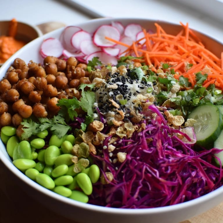 Fresh and colorful ASMR Crunch Snack Bowls topped with roasted chickpeas and crispy rice puffs.