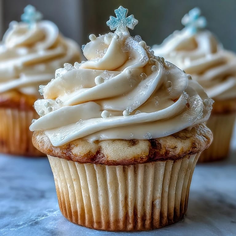 Soft Communion cupcakes frosted with creamy buttercream and delicate fondant crosses.