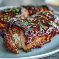 Juicy honey garlic grilled chicken thighs with sticky glaze, perfect for summer barbecues and family dinners.  
