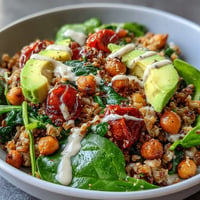 Hearty Ancient Grains Bowl with vibrant vegetables and creamy lemon-tahini dressing.